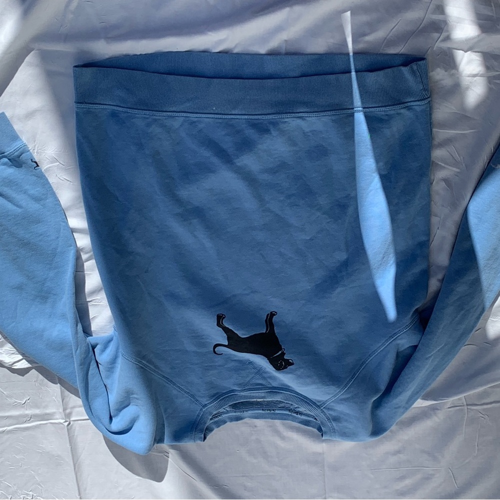 Sm bleach stain on one sleeve.  Green highlighter/marker as shown.